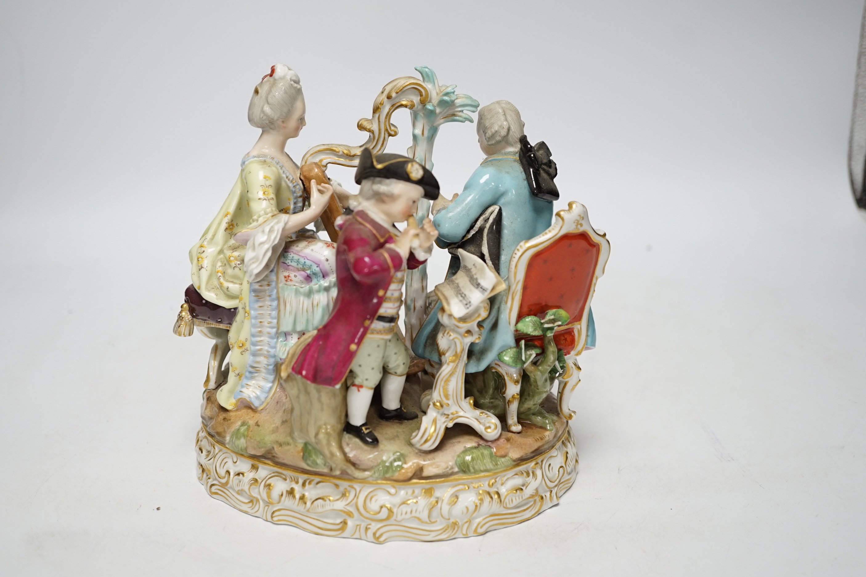 An early 20th century Meissen figure group of musicians, stamped D48, 18cm